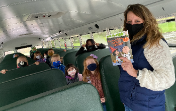 Bus Driver Reads to Students